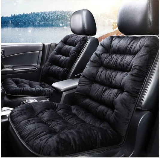 Black plush car seat cushion with full back support installed in a car