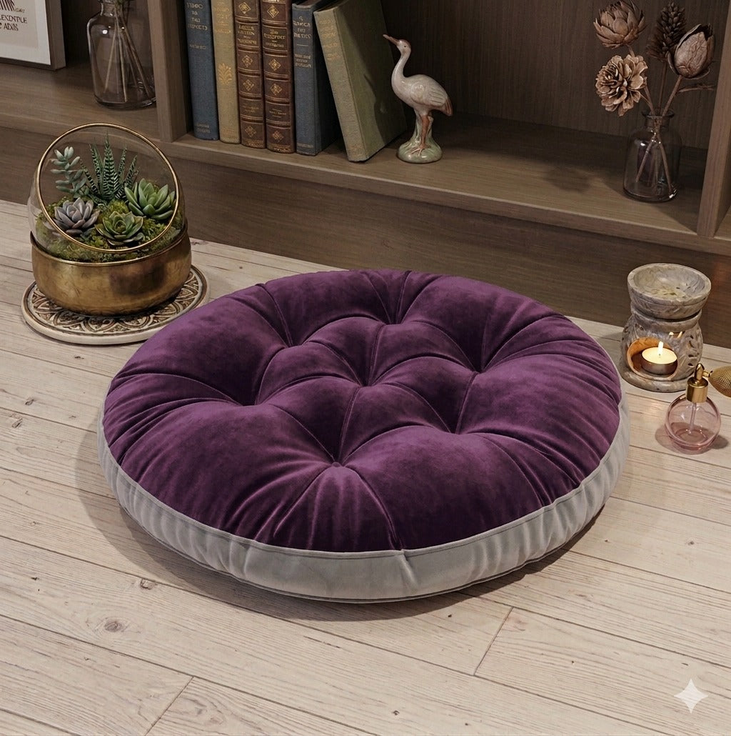 Luxury purple velvet round tufted floor cushion with grey base on wooden floor